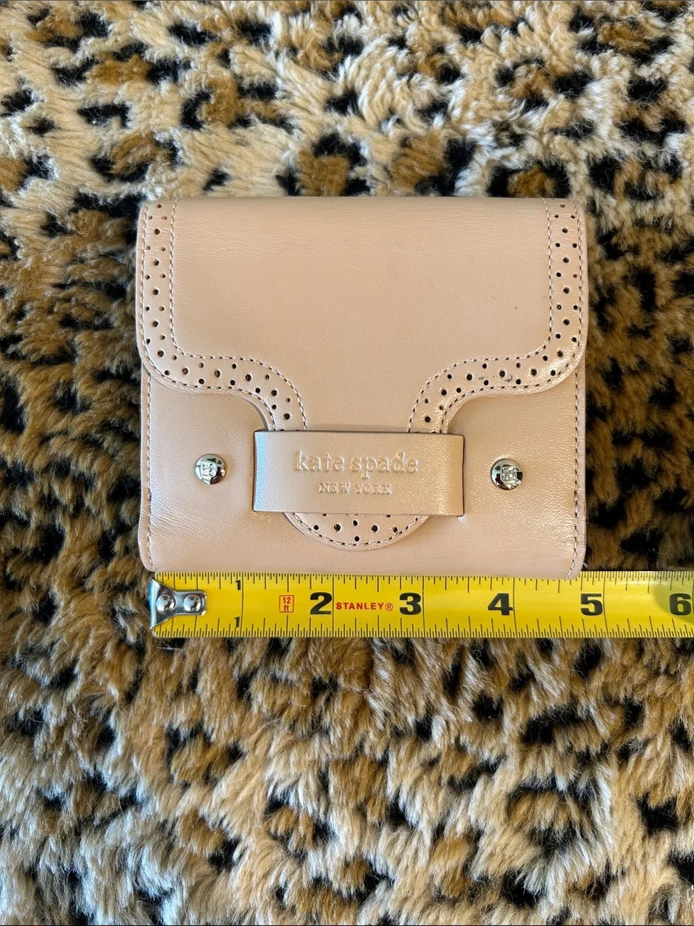 kate spade cream perforated leather bifold wallet